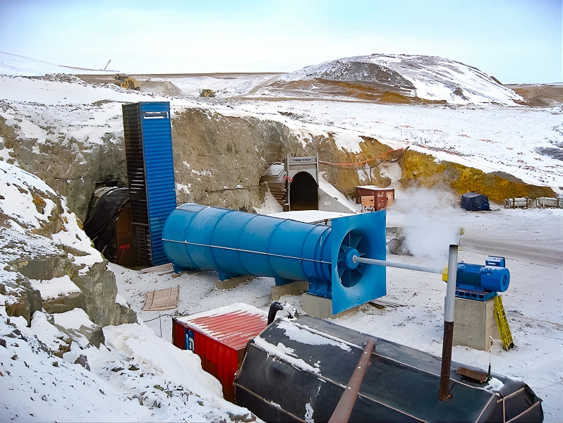 A large industrial ventilation system powered by an electric motor at the entrance of an underground mine  in Manitoba’s snowy and cold climate.
