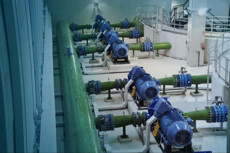 Industrial automation facility in Calgary with electric motors connected to pump systems.