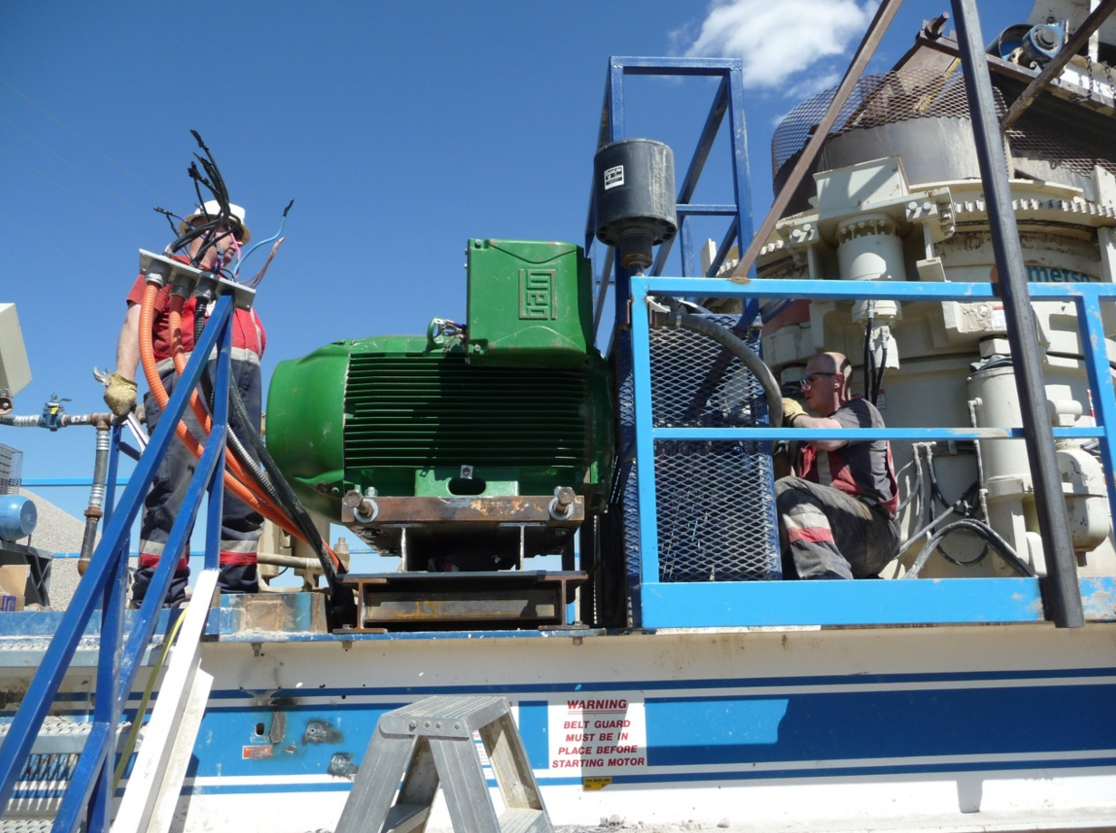 A technician performs maintenance on an electric motor in Canada, emphasizing reliability, longevity and operational efficiency.