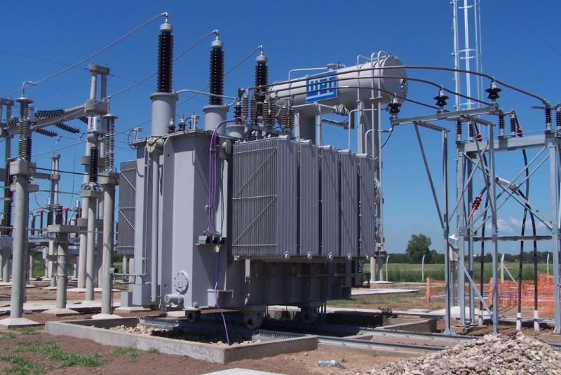 High-voltage power transformer installed outdoors, showcasing energy infrastructure and distribution capabilities.