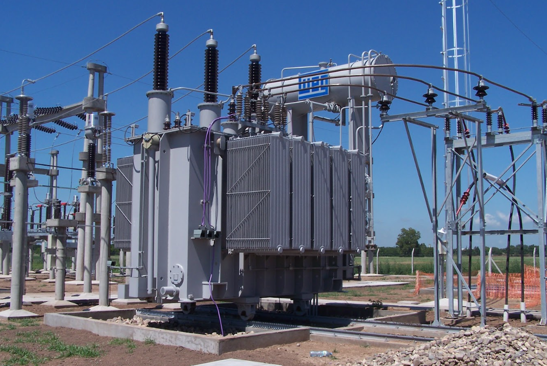 High-voltage power transformer installed outdoors, showcasing energy infrastructure and distribution capabilities.