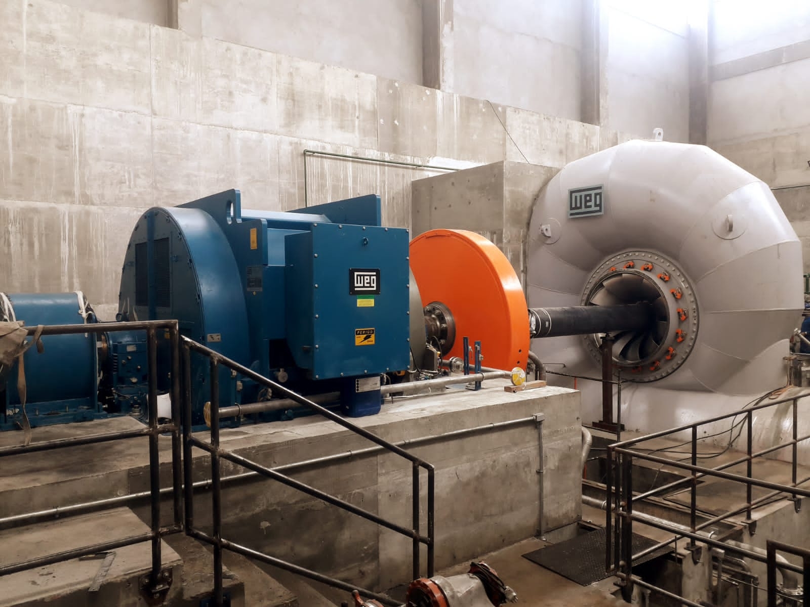 An industrial facility showcases the installation of large electric motors, highlighting the motor-to-load connection.