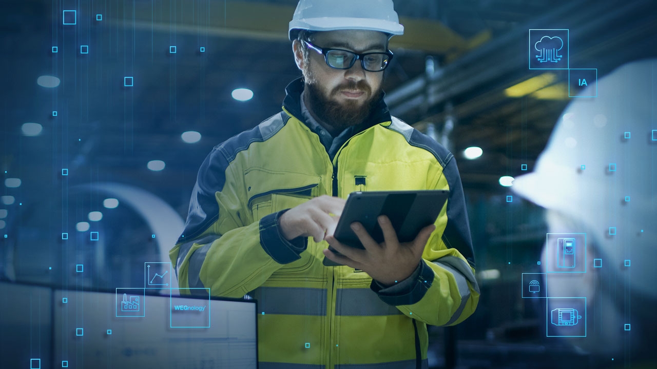 Engineer in a high-visibility jacket and hard hat using a tablet in a WEG industrial facility, with digital icons representing industrial automation and data analysis in the background.