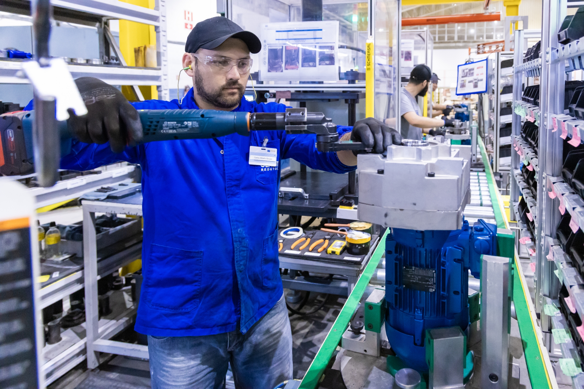 Engineers at a scalable OEM production line use pre-configured electric motor systems for automation.