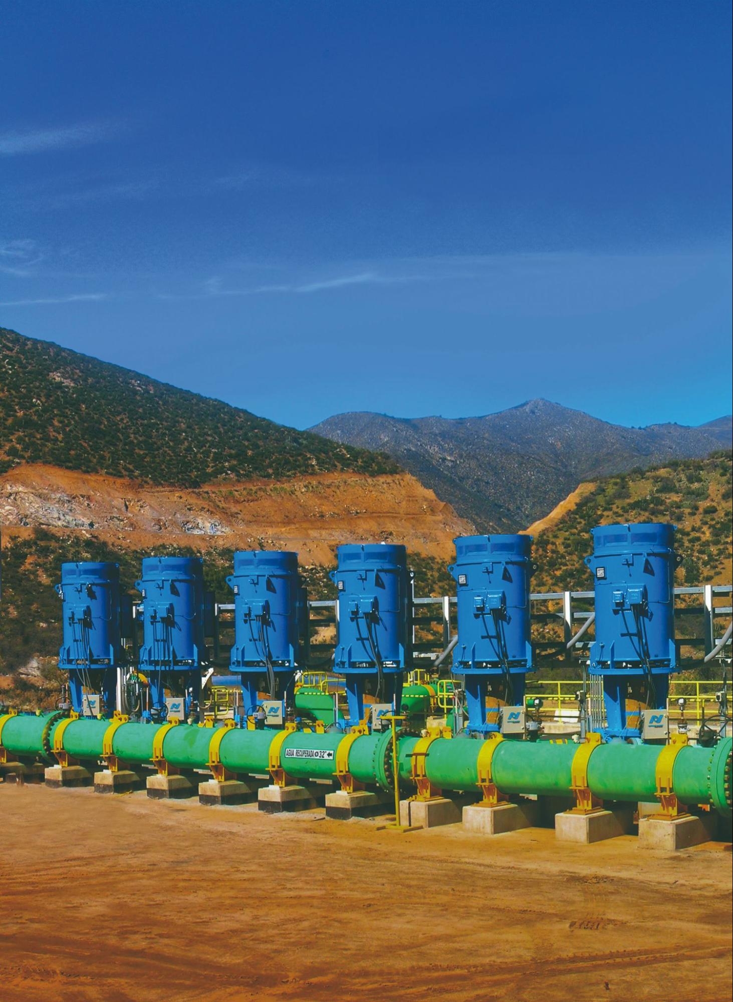 Industrial electric motors installed in a mining system, showing enclosure housing.