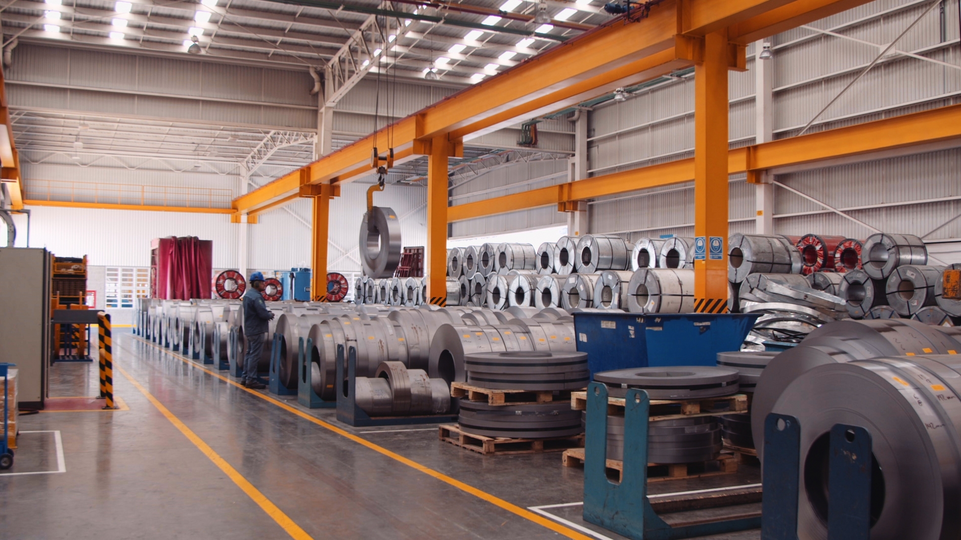 WEG lamination processing factory showcasing rolls of steel ready for manufacturing, symbolizing material advancements in production.